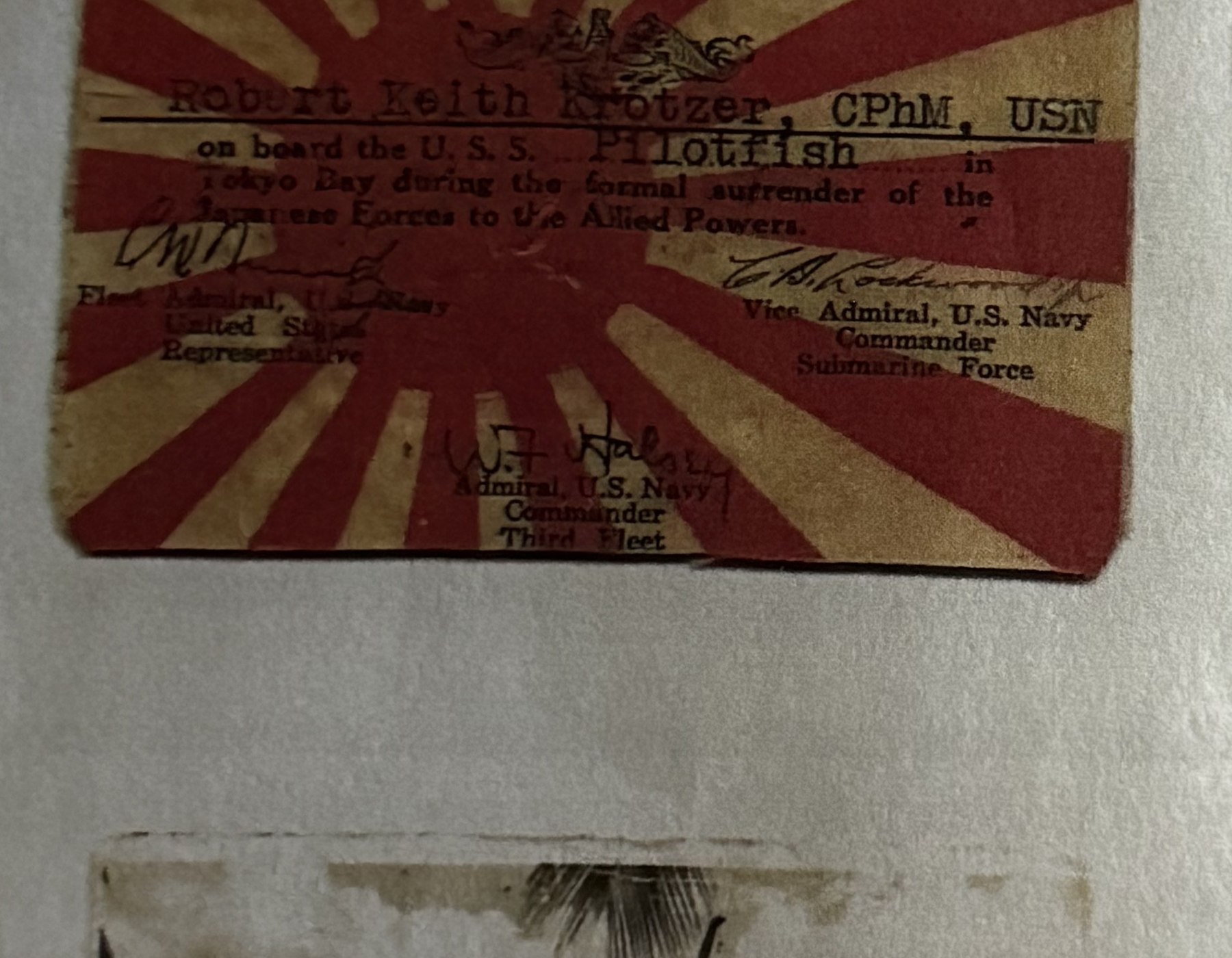 Card certifying Robert Keith Krotzer's presence aboard USS Pilotfish for the Japanese surrender, signed by Nimitz, Lockwood, and Halsey